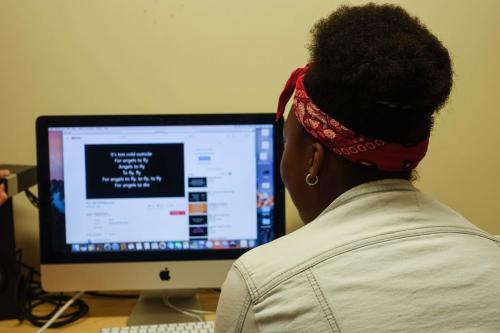 Naomi utilizing Foróige’s recording studio to practice her singing.